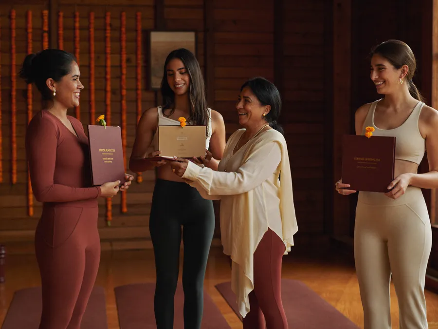Yoga teacher training certification ceremony in a wooden shala in Rishikesh
